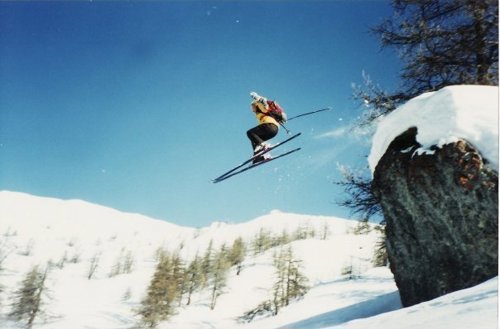 Picture of Nigel Halpern skiing downhill.