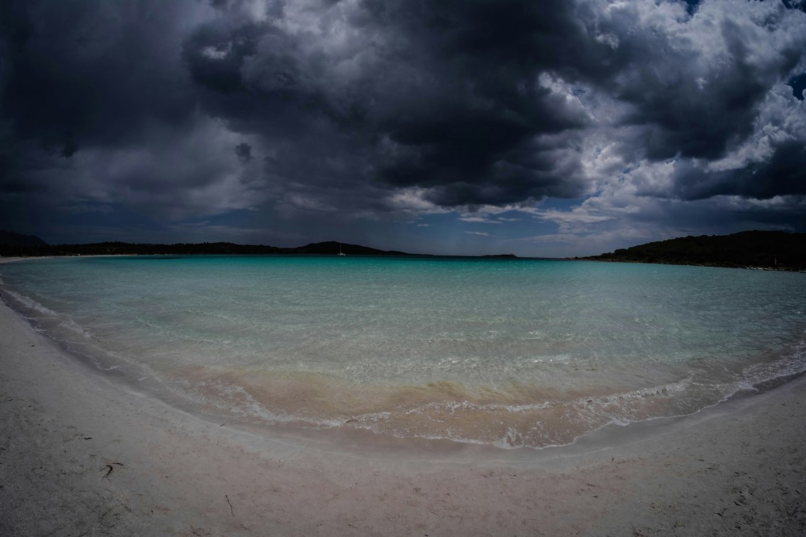 beautiful beach beneath dark sky